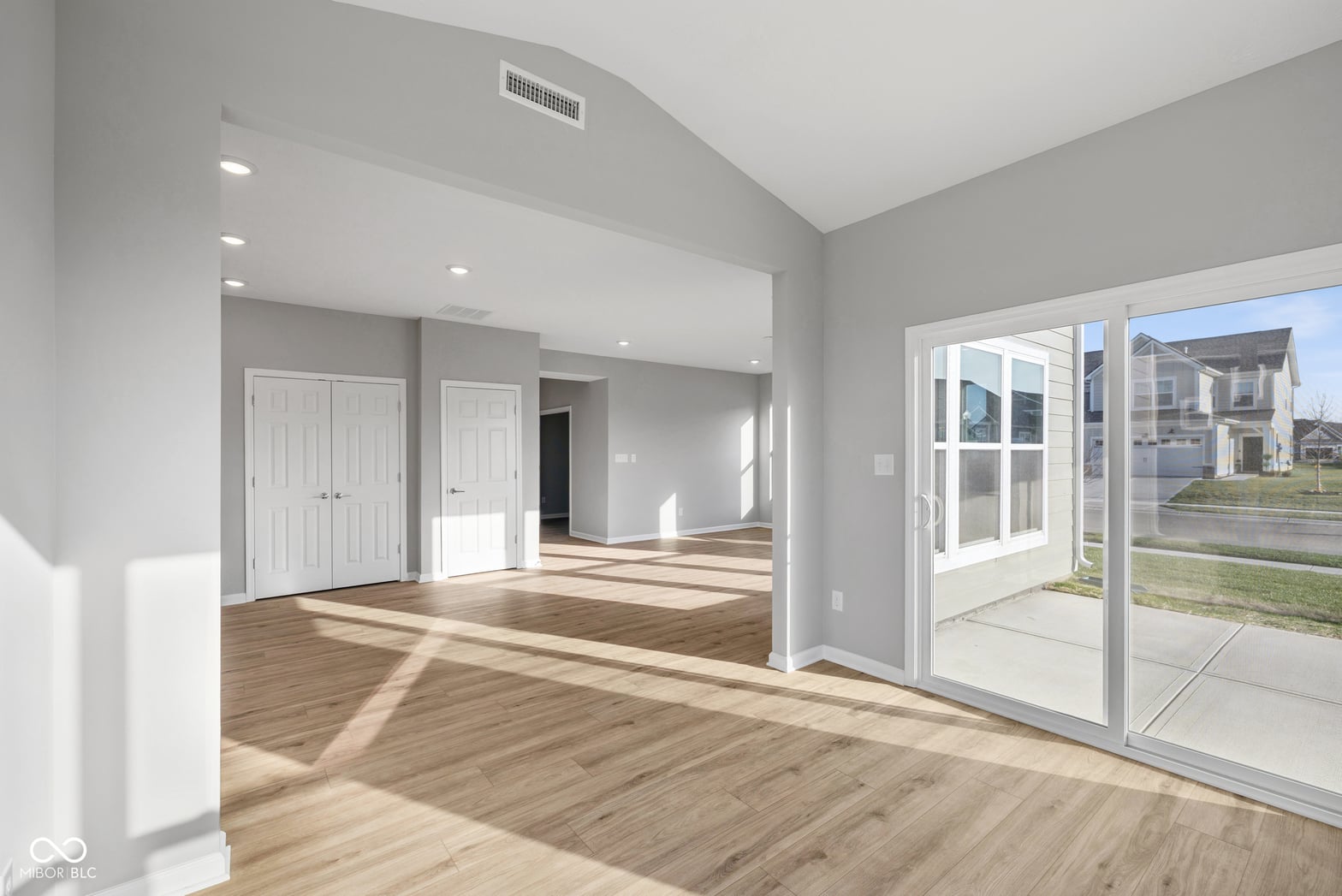 Bright, open family room with patio access and natural light.