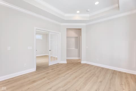 Primary bedroom at 16098 Quarter Pole Lane, Westfield, IN — Bright primary suite with tray ceiling and walk-in closet.