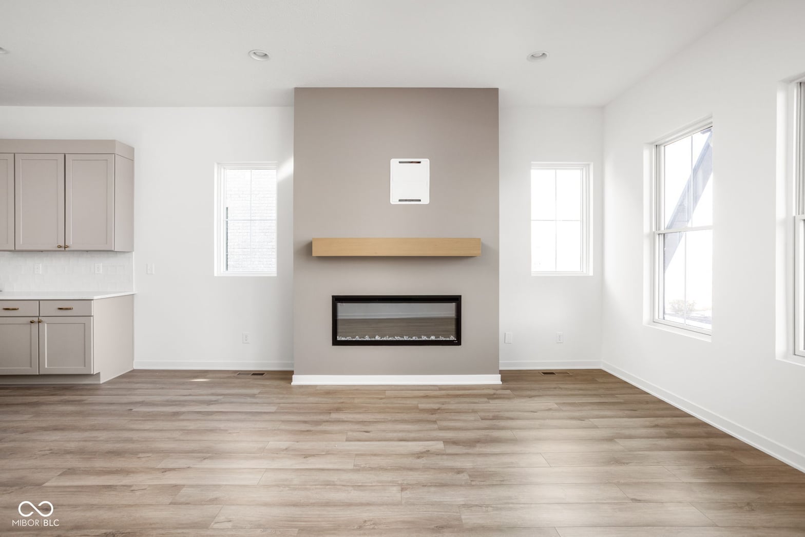 Modern living space with striking electric fireplace feature wall.