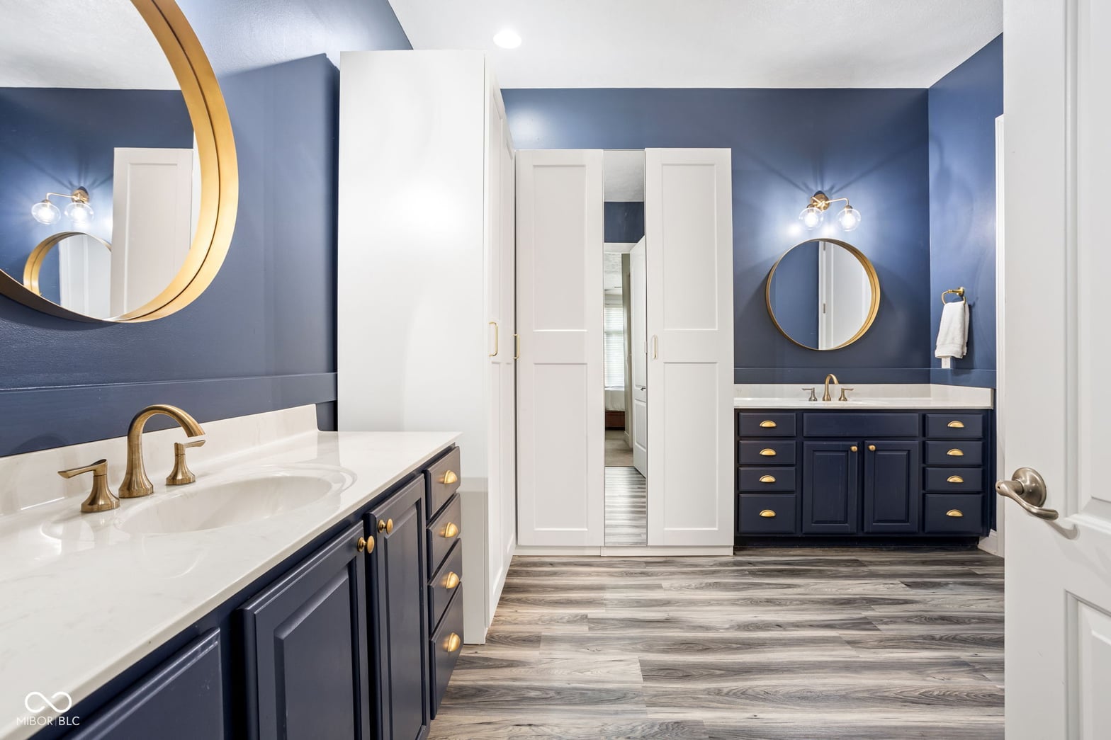 Stunning primary bath with dual vanities and designer finishes.