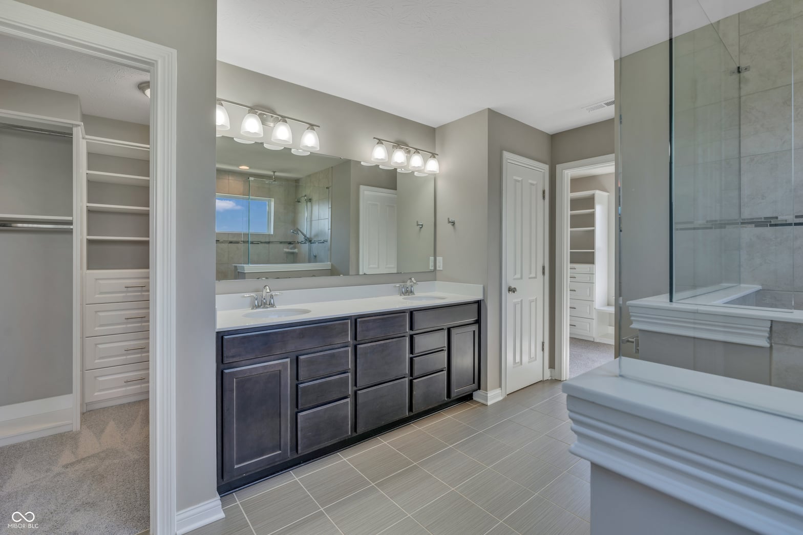 Luxurious primary bath with dual vanity and soaking tub
