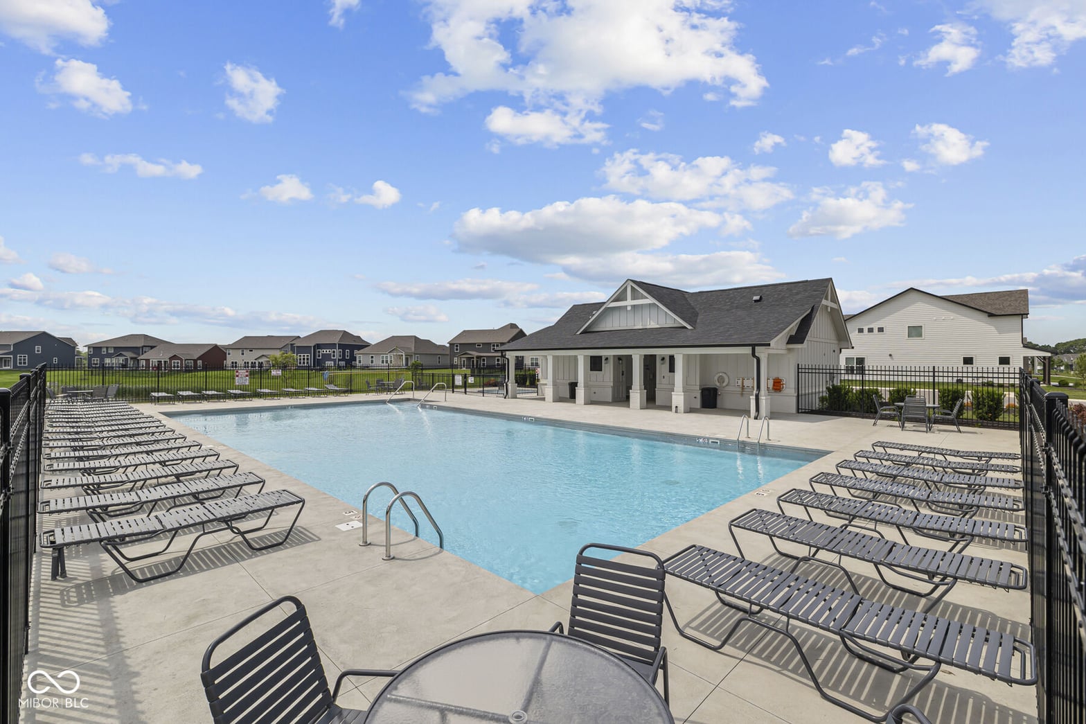 Resort-style community pool with modern amenities and lounging areas.