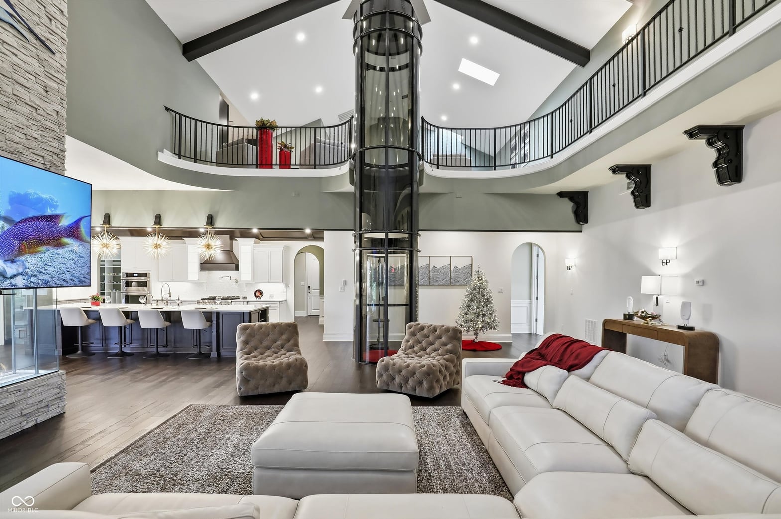 Stunning two-story open concept with glass elevator centerpiece.