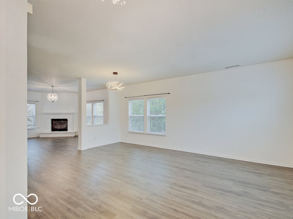Bright, open living space with fireplace and modern finishes.
