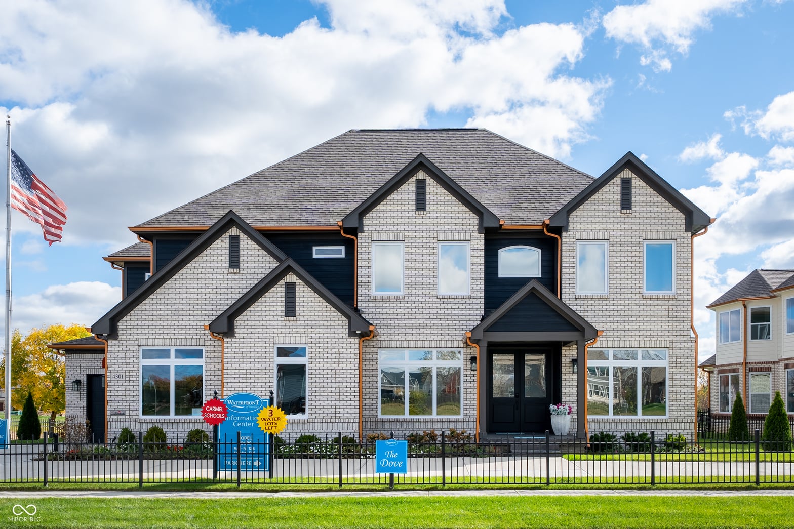 Front exterior at 4301 Stone Lake Drive, Zionsville, IN — Stunning new construction home with elegant brick exterior.