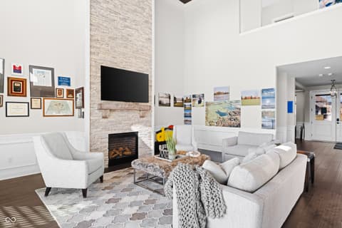 Living room at 4301 Stone Lake Drive, Zionsville, IN — Bright living room with fireplace and soaring ceilings