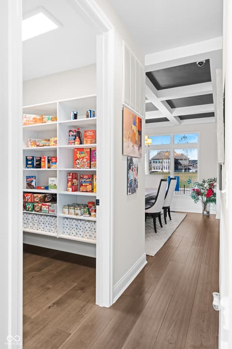 Kitchen at 4301 Stone Lake Drive, Zionsville, IN — Custom walk-in pantry with organized built-in shelving.
