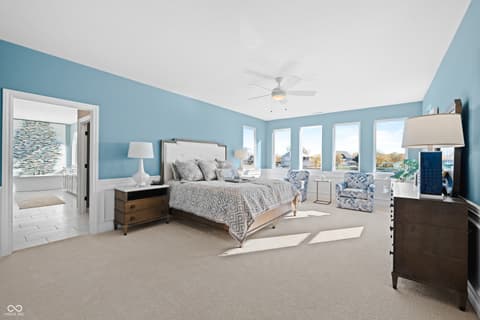 Primary bedroom at 4301 Stone Lake Drive, Zionsville, IN — Bright, spacious primary suite with ensuite bath.