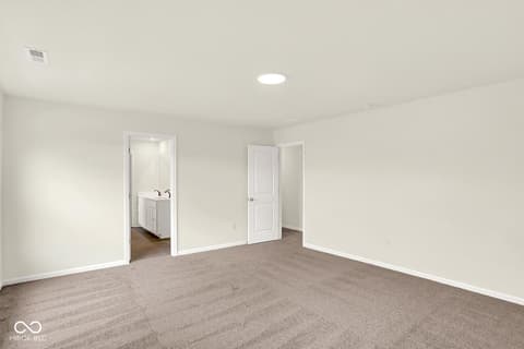 Primary bedroom at 3746 Thomas Jefferson Court, Westfield, IN — Spacious primary suite with ensuite bathroom and closet.
