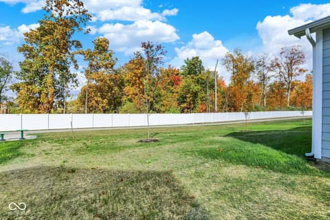 Yard at 3746 Thomas Jefferson Court, Westfield, IN — Large fenced yard with mature trees and open space.