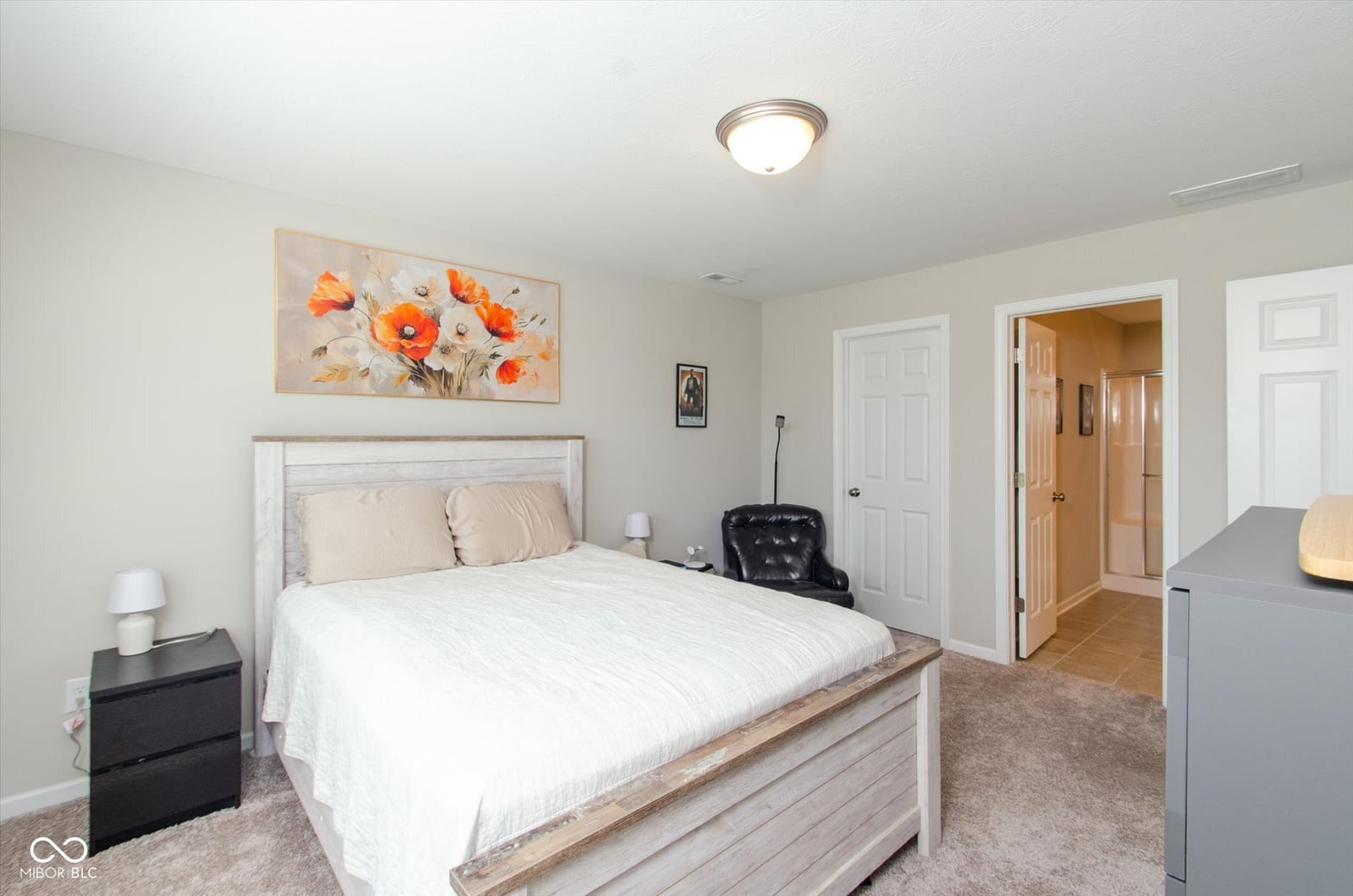 Bright primary suite with ensuite bath access and modern finishes.