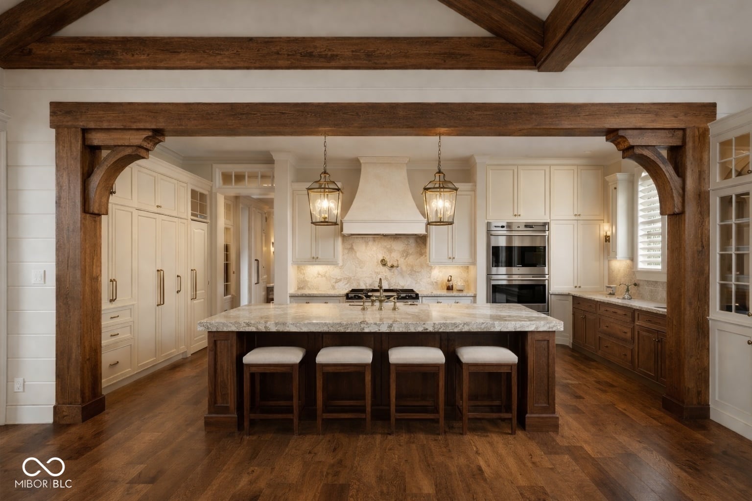 Luxurious kitchen with granite island and architectural wood details.