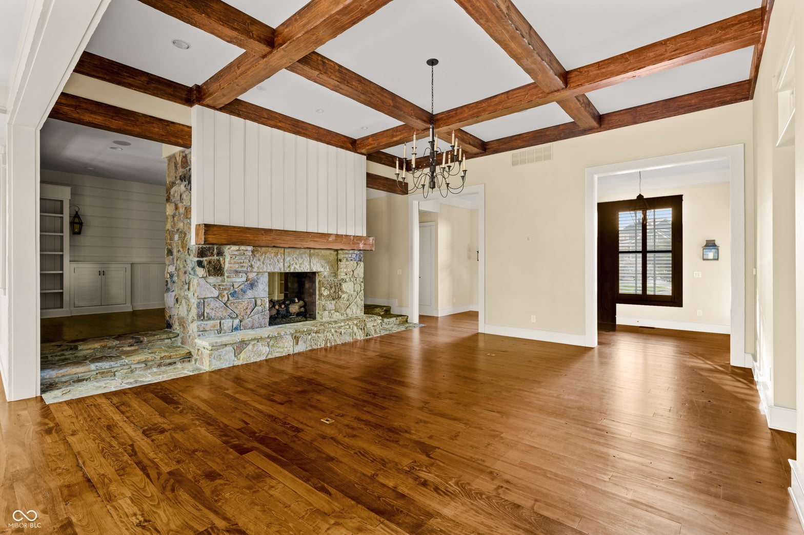 Elegant living room with exposed beams and fireplace.