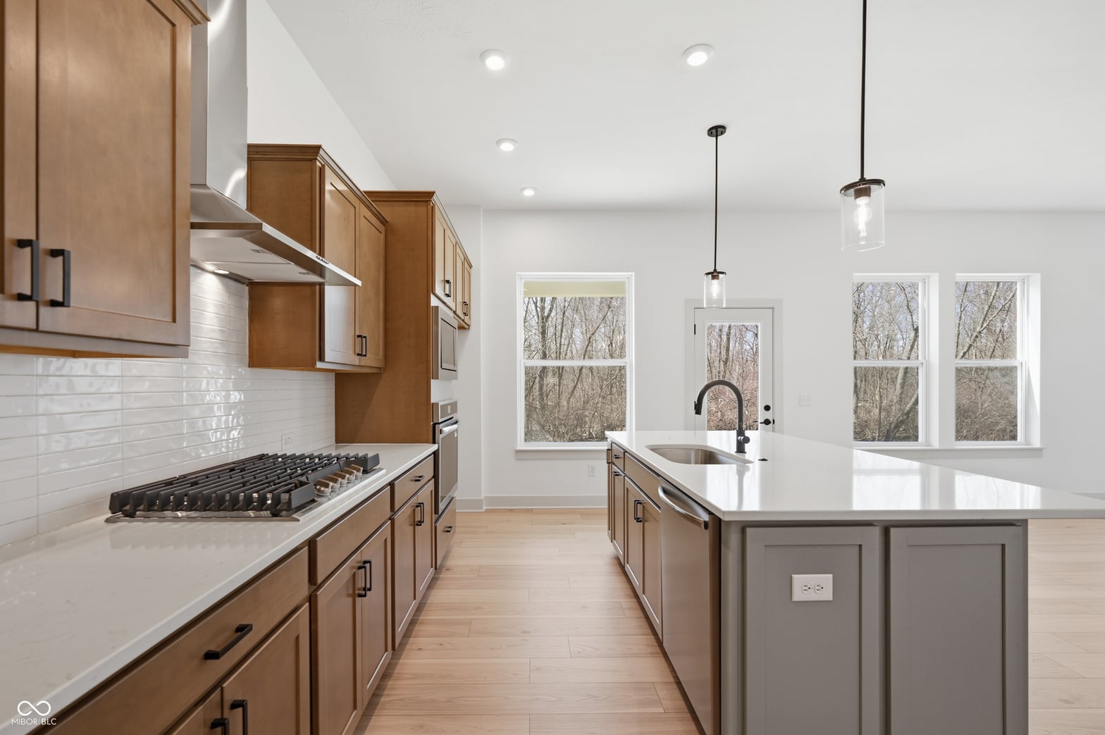 Bright, modern kitchen with premium finishes and island.