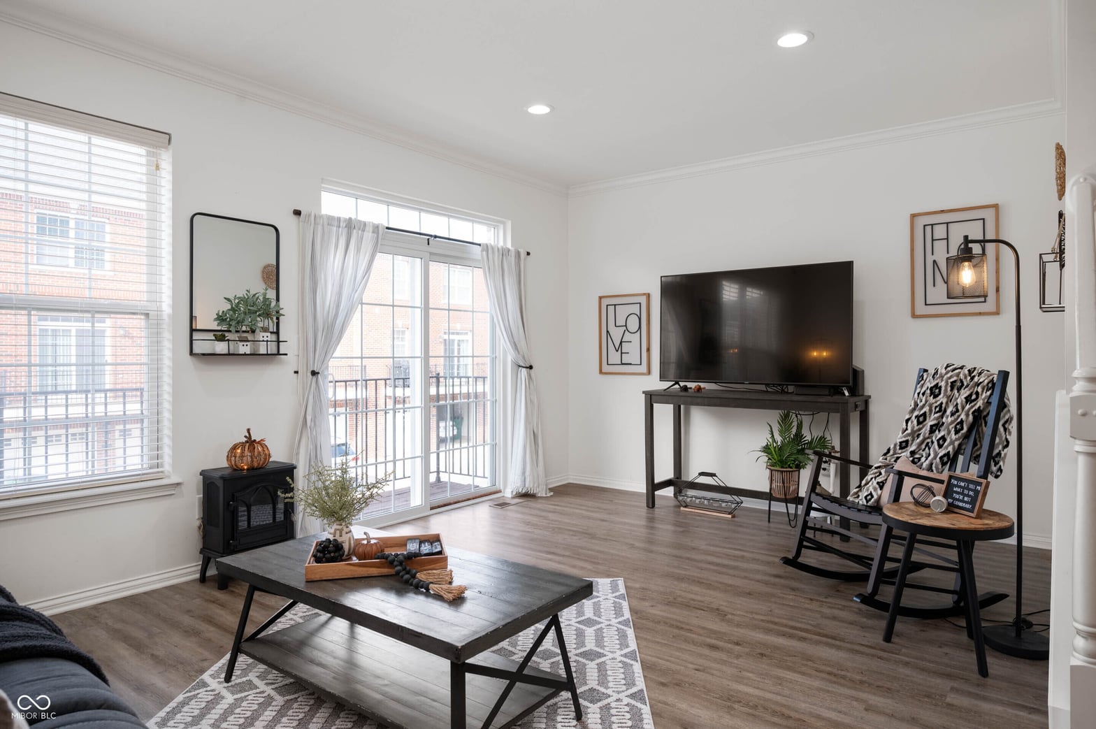 Bright contemporary living space with balcony access.