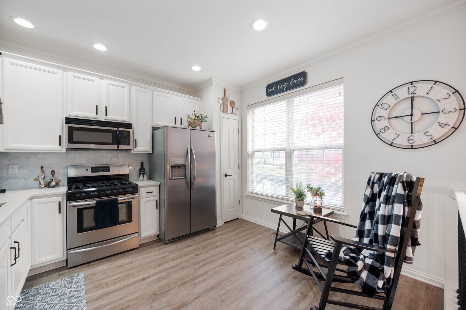Bright updated kitchen with stainless steel appliances.