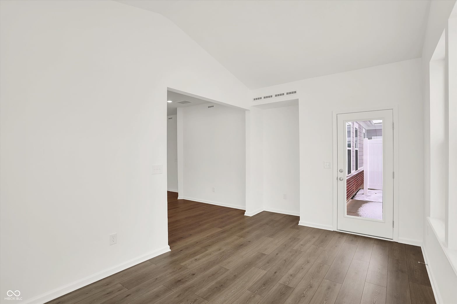 Spacious primary bedroom with modern finishes and natural light.