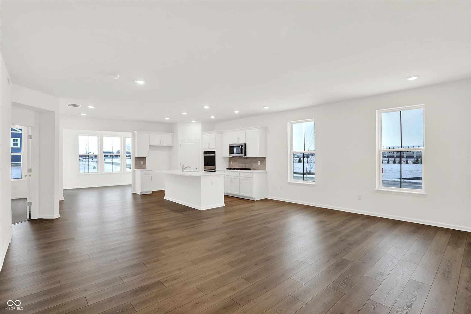 Bright modern kitchen with waterfront views and open layout.
