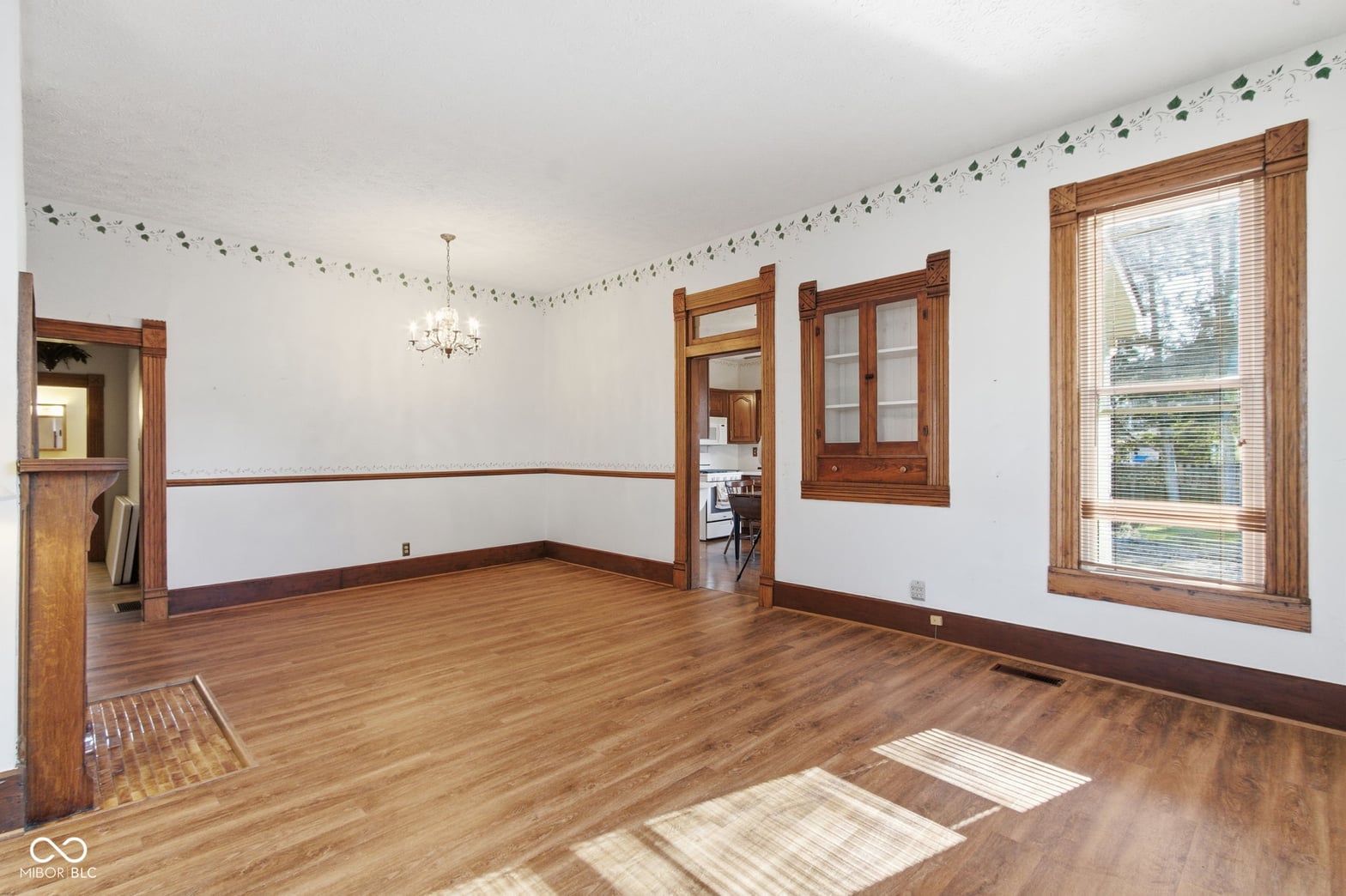 Spacious traditional dining room with original hardwood floors.