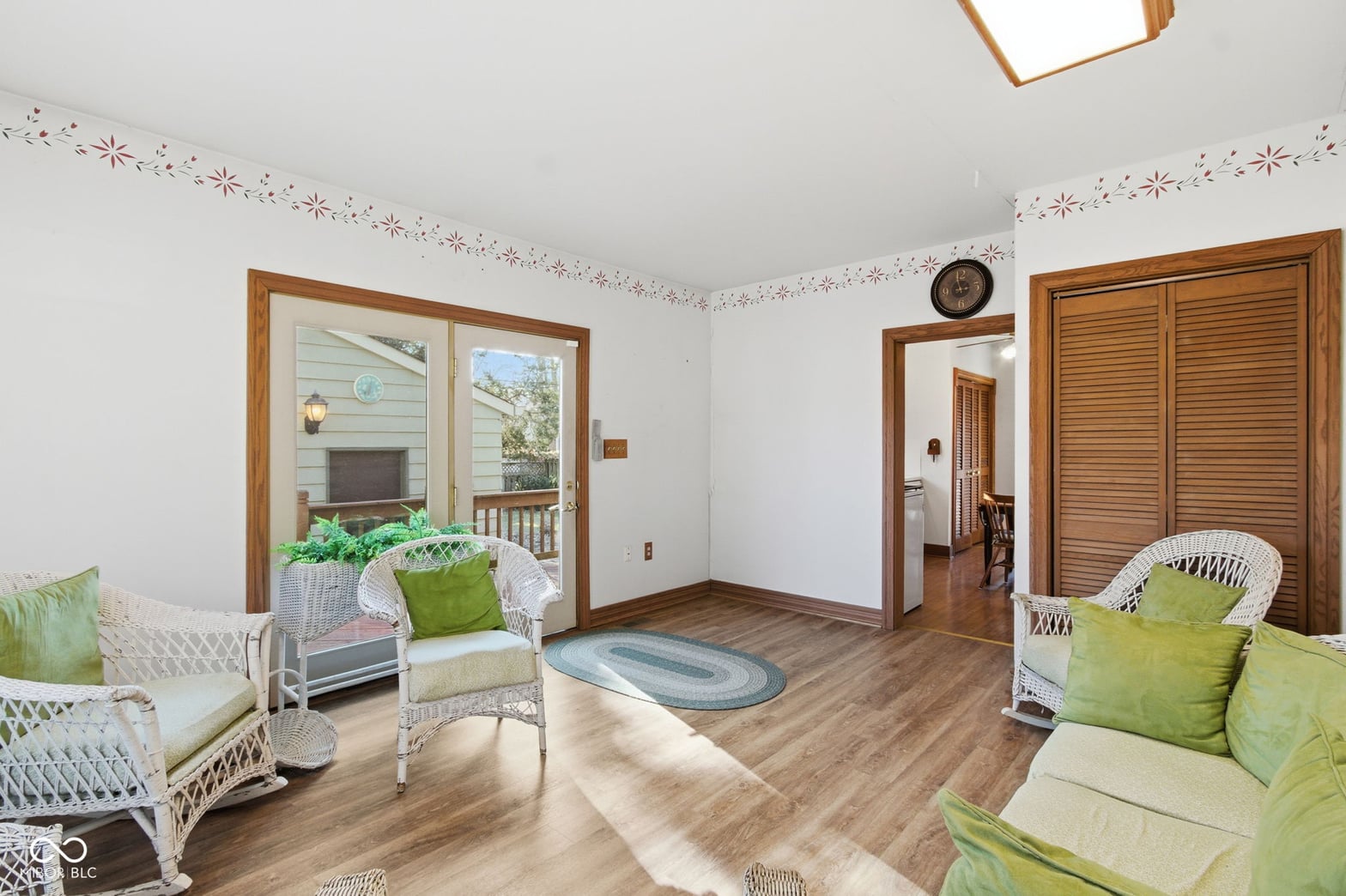 Spacious bedroom with deck access and natural light.