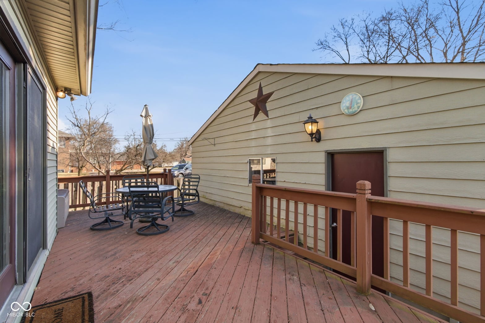 Spacious wooden deck with rustic charm and seating.