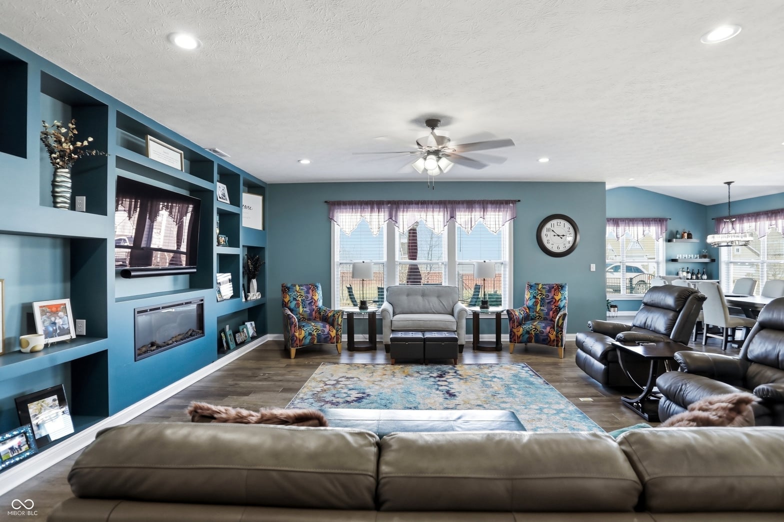 Spacious family room with custom built-ins and modern finishes.