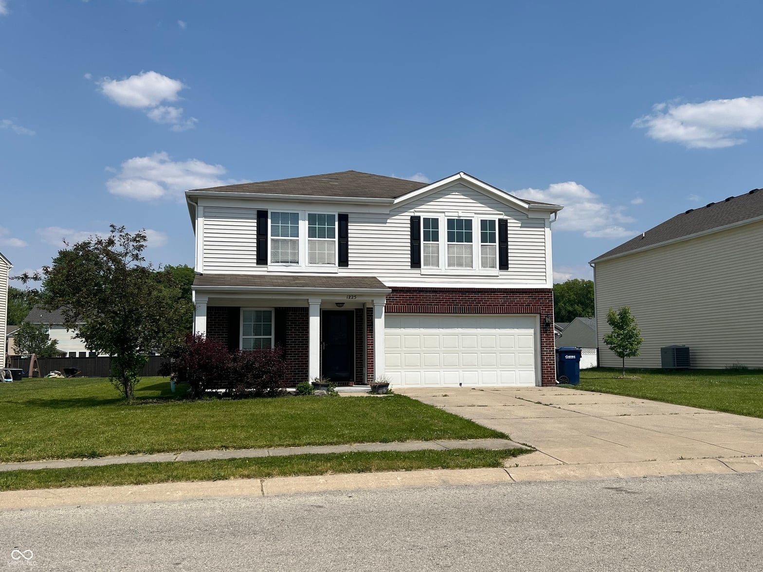 Front exterior at 1225 Maple Trace Way, Sheridan, IN — Charming two-story colonial with brick and siding exterior.