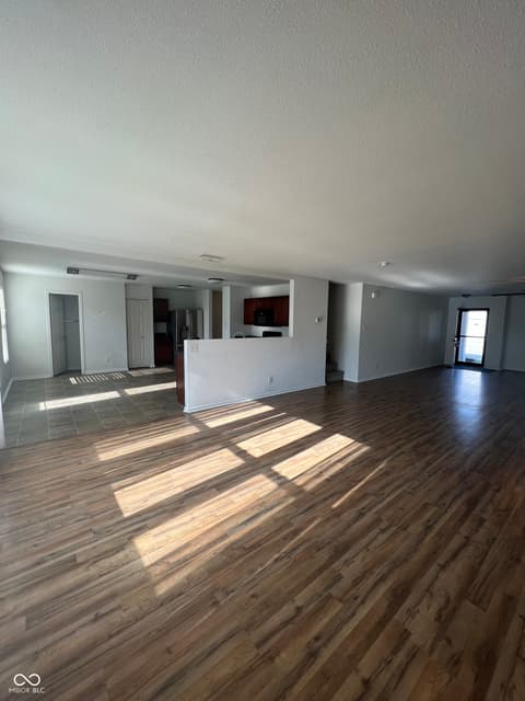 Living room at 1225 Maple Trace Way, Sheridan, IN — Bright open-concept living space with modern flooring.