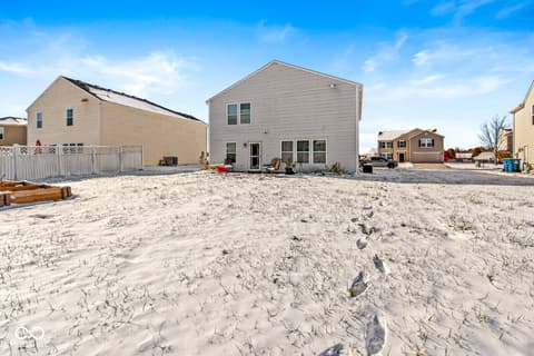 Backyard at 1225 Maple Trace Way, Sheridan, IN — Spacious beachfront home with sandy yard and ocean access.