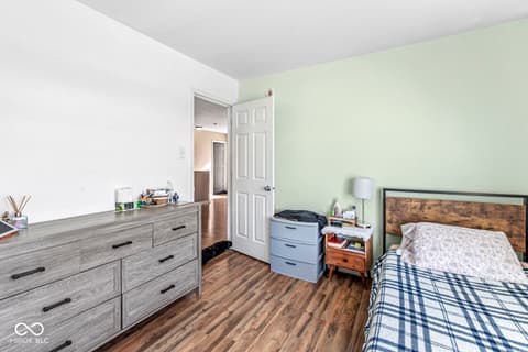 Bedroom at 1225 Maple Trace Way, Sheridan, IN — Spacious bedroom with hardwood floors and ample storage.