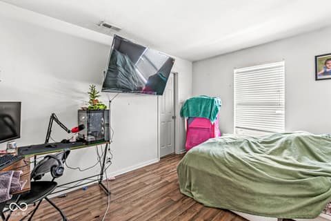 Bedroom at 1225 Maple Trace Way, Sheridan, IN — Spacious bedroom with hardwood floors and natural light.