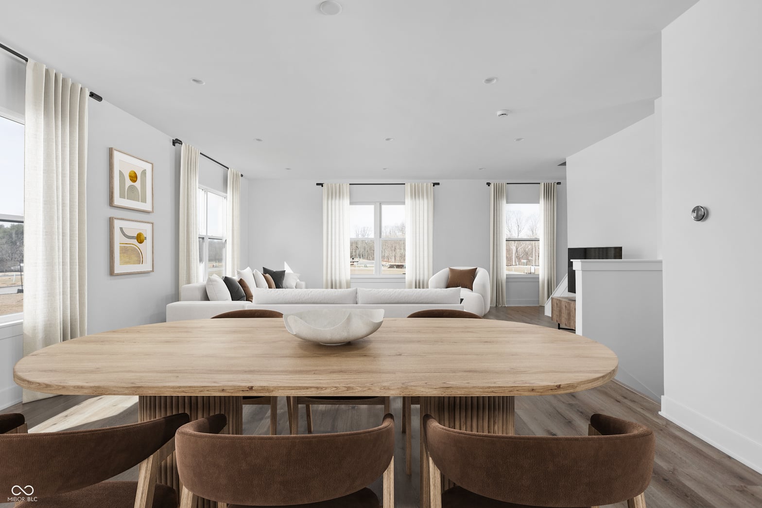 Bright contemporary dining with seamless living room flow.