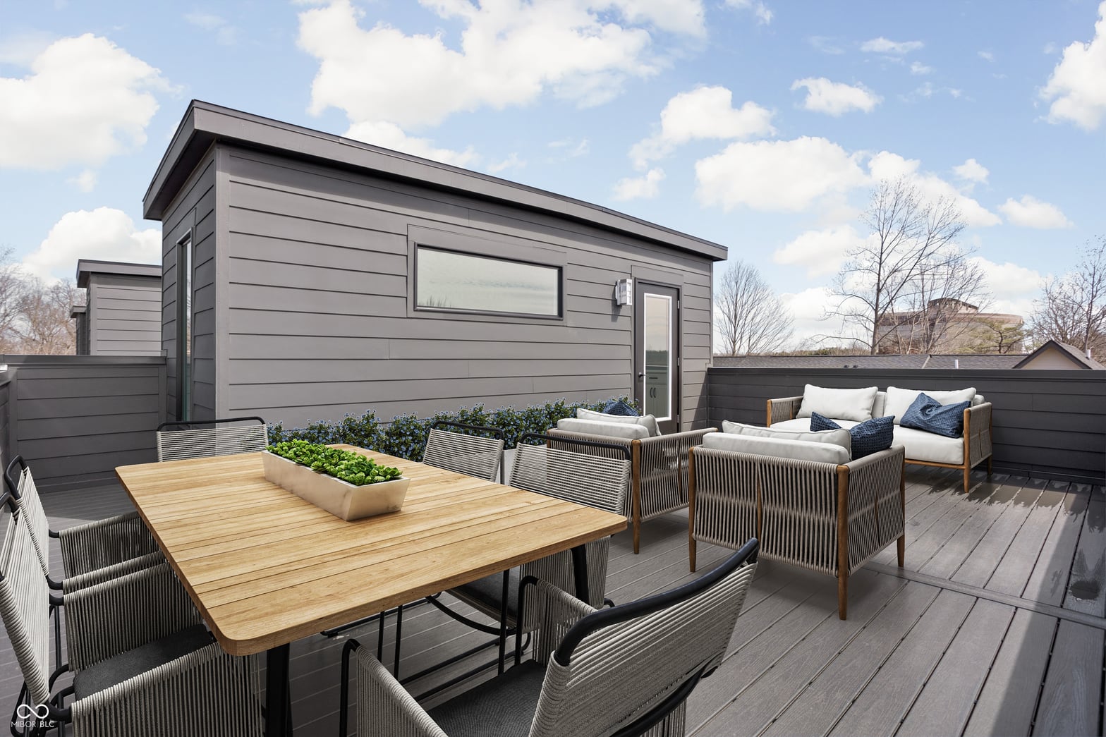 Stylish modern outdoor deck with dining and lounge seating.