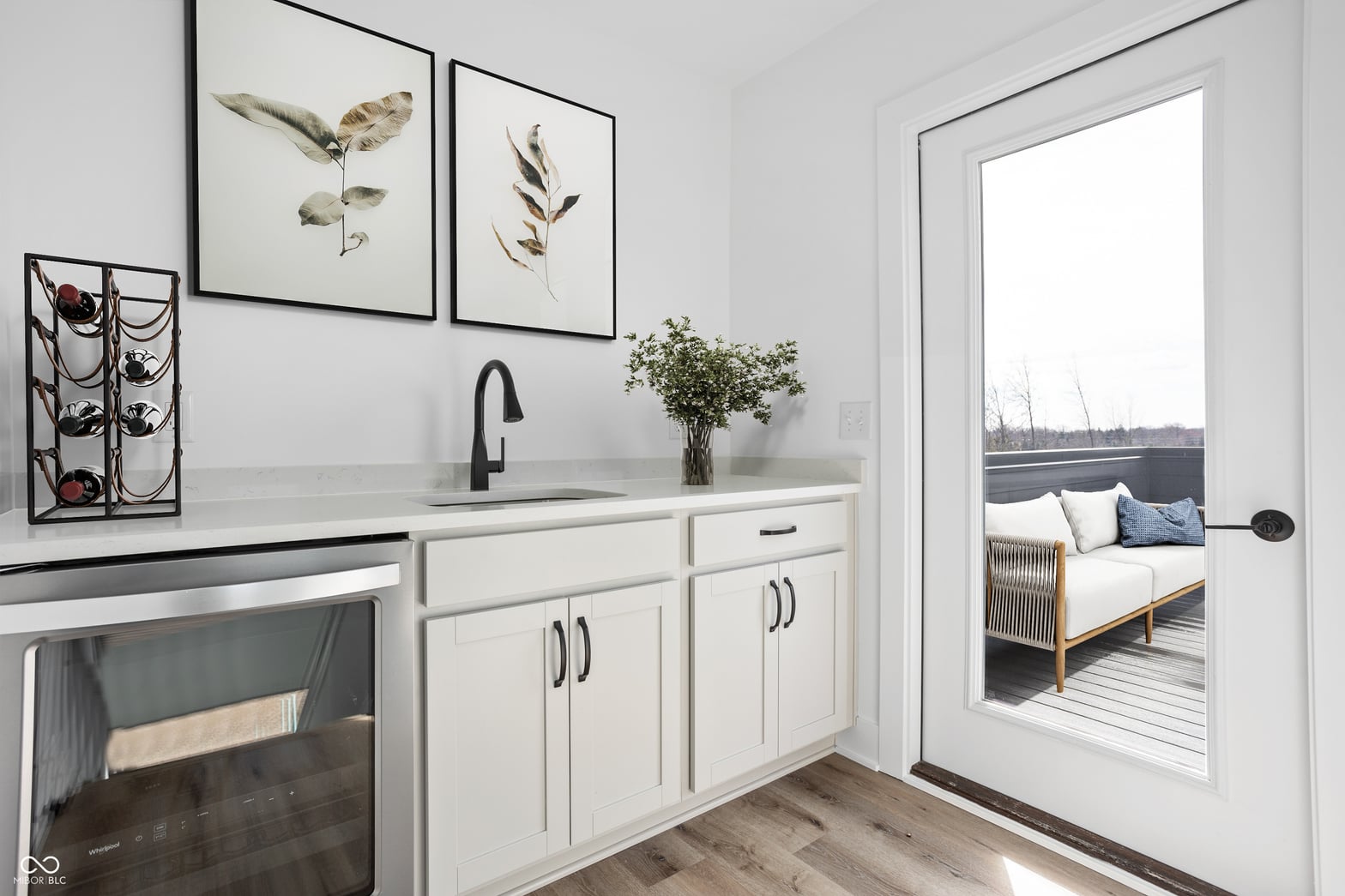 Modern kitchen with deck access and updated finishes.
