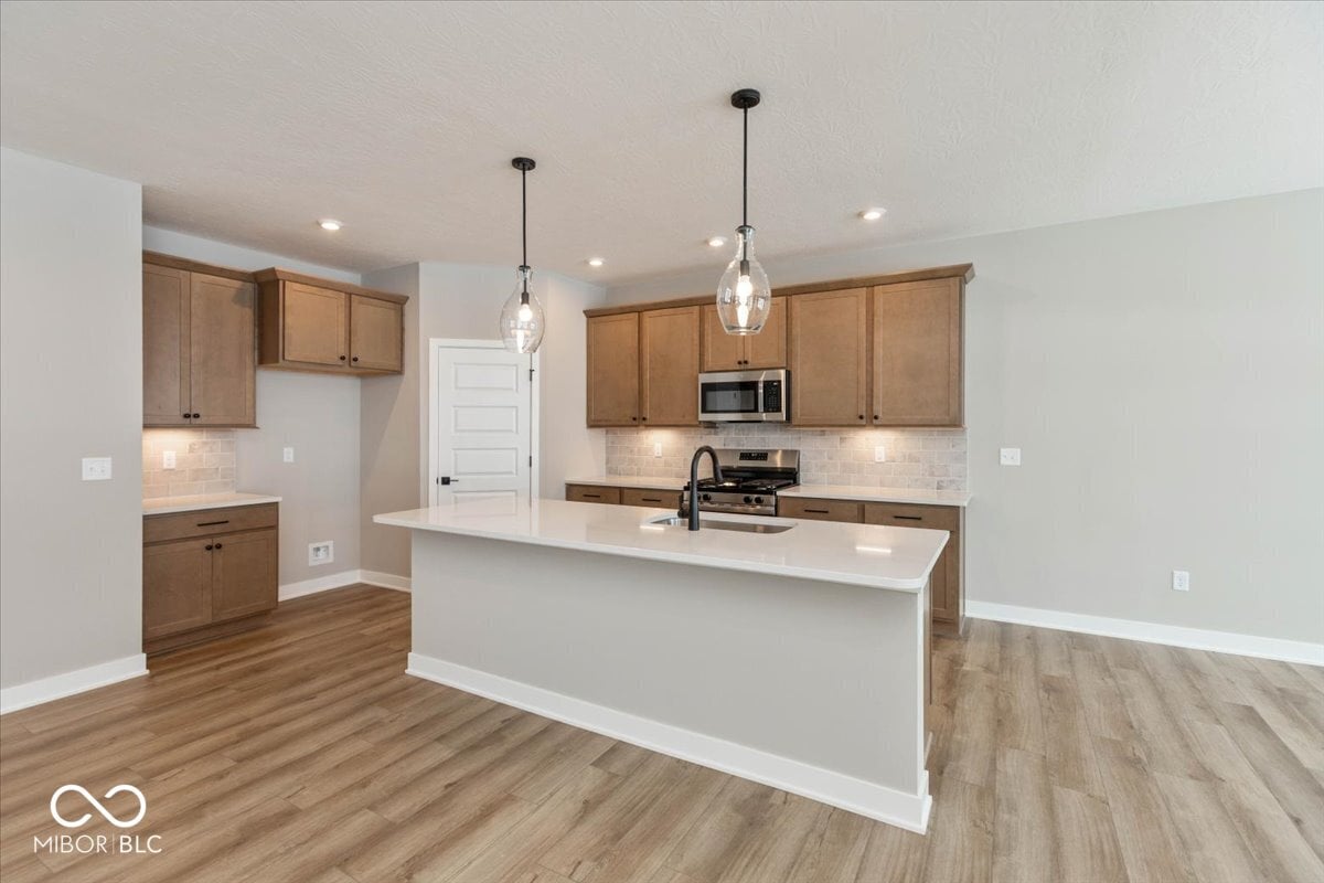 Modern kitchen with island and premium finishes throughout.