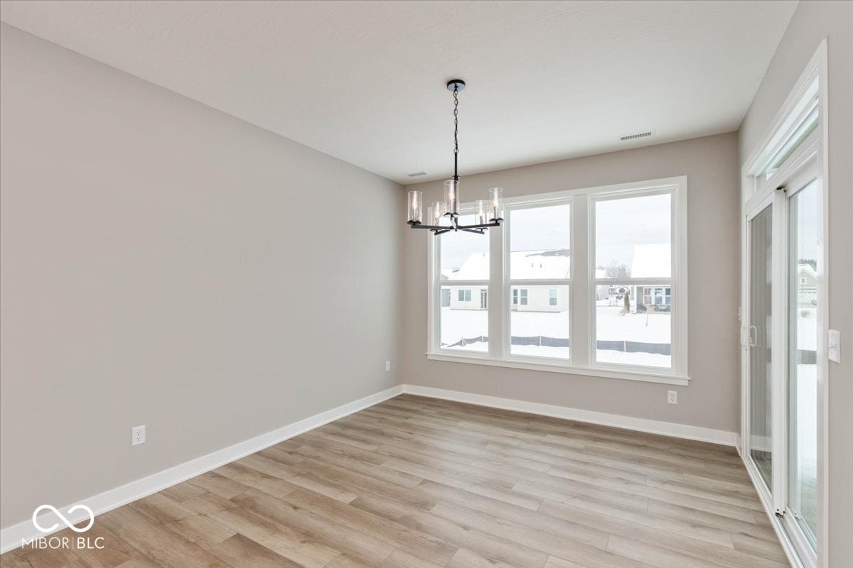 Bright dining space with expansive windows and modern finishes.