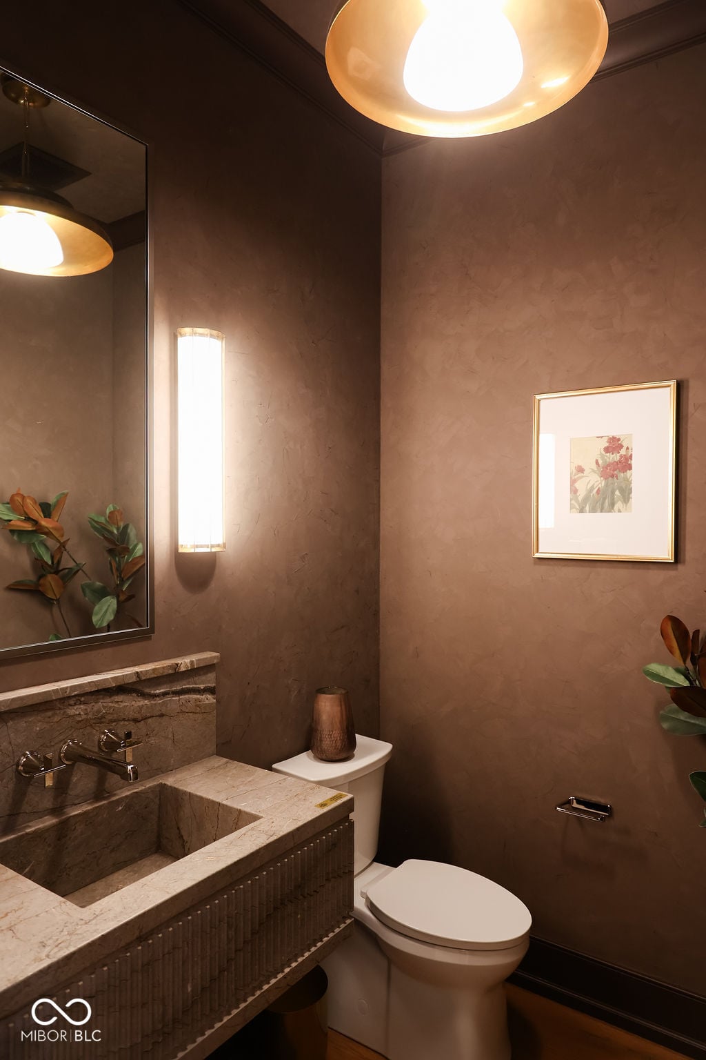 Luxe spa bathroom with marble finishes and warm ambiance.