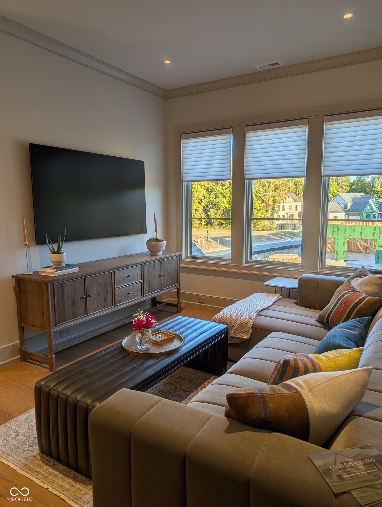 Luxurious family room with water views and smart home features.