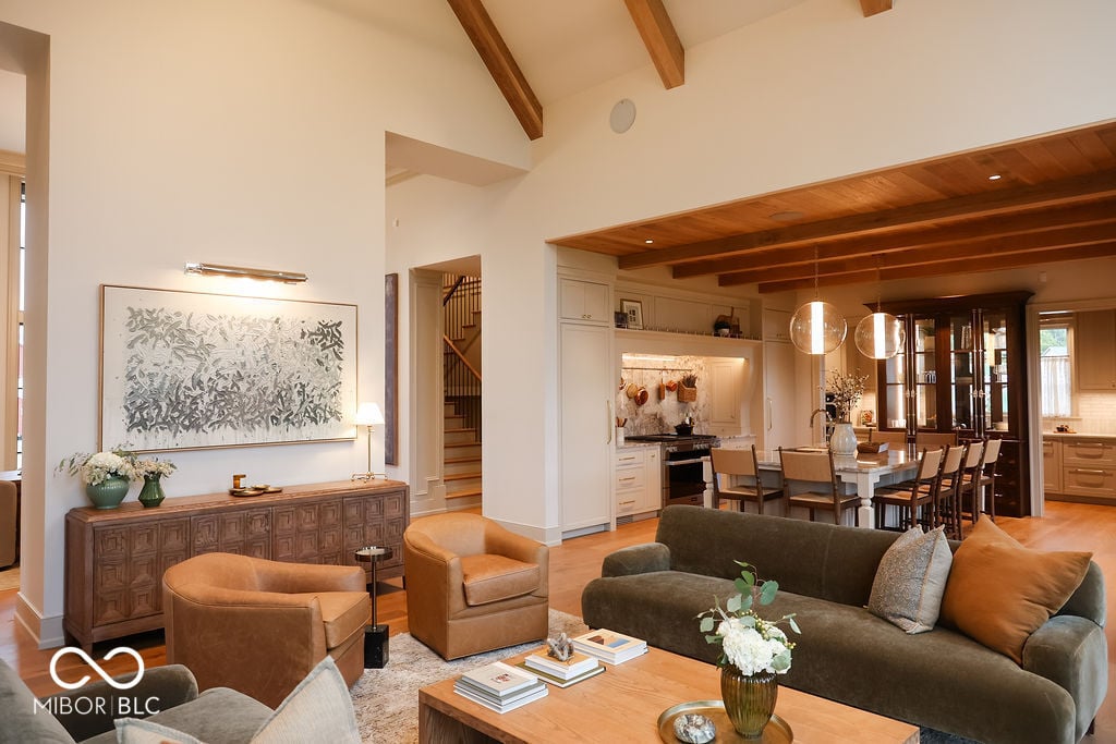 Spacious contemporary living room with exposed beams and open concept.