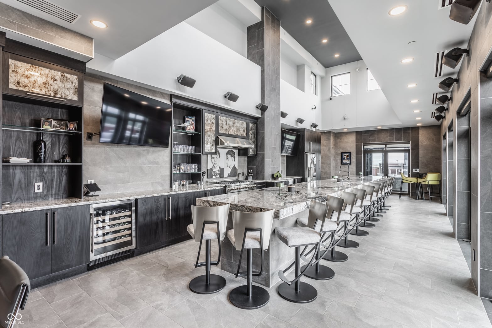 Luxury modern kitchen with expansive island and entertainment space.