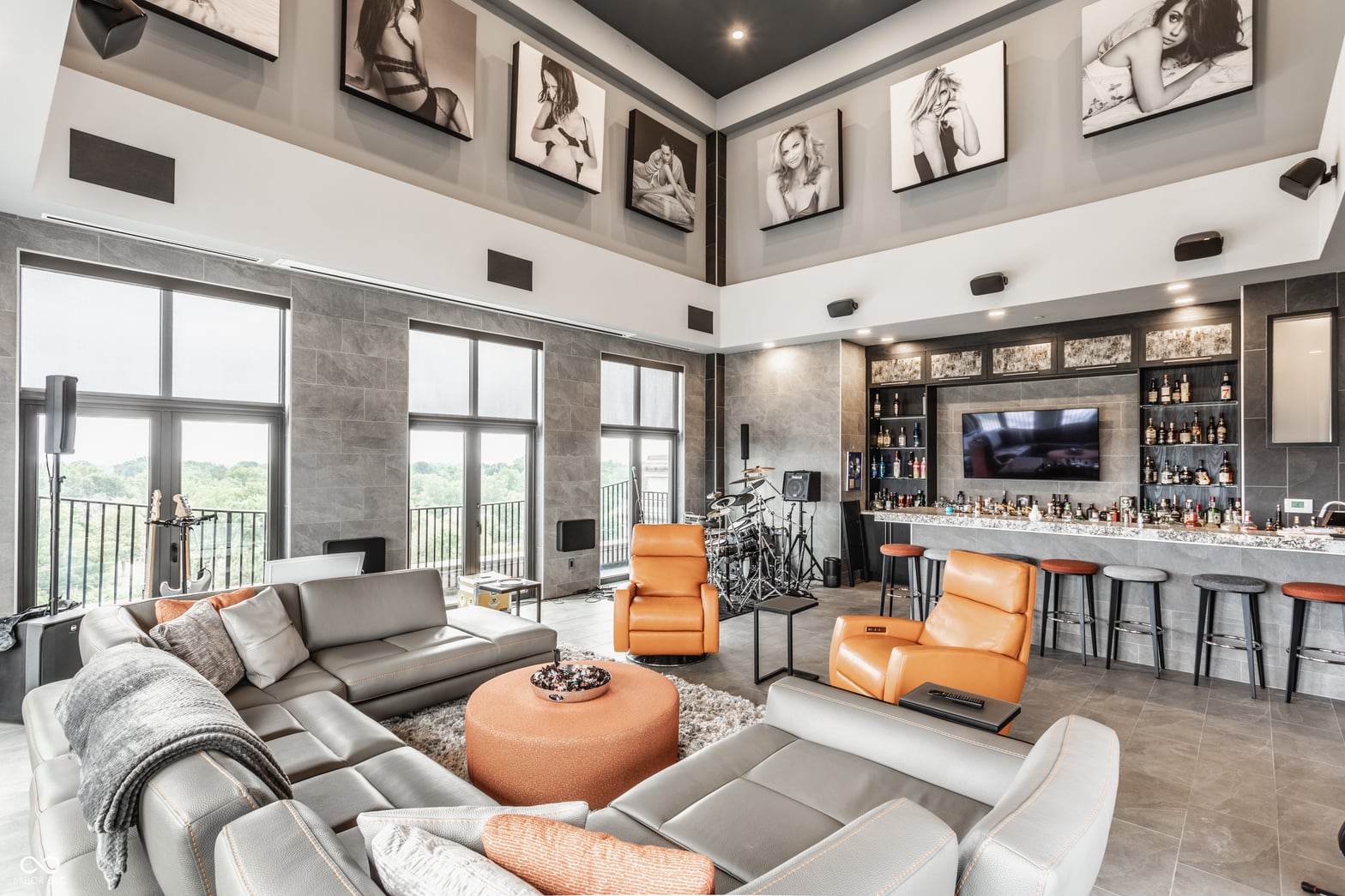 Luxury open-concept living with wet bar and scenic views.