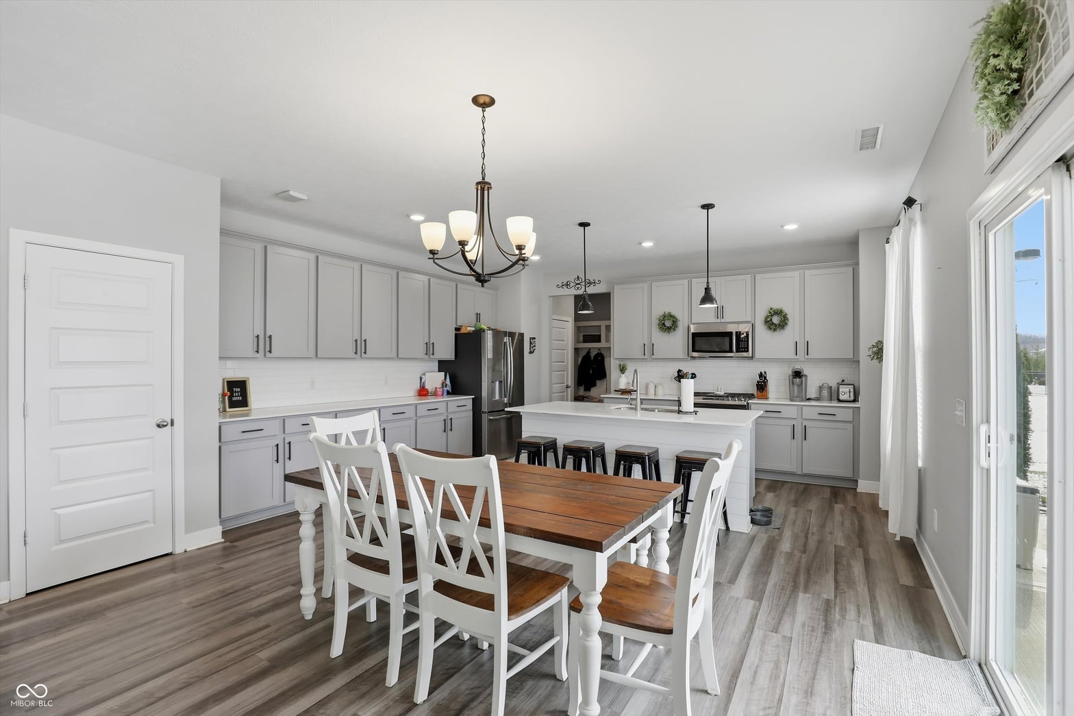 Bright updated kitchen with island and modern appliances.