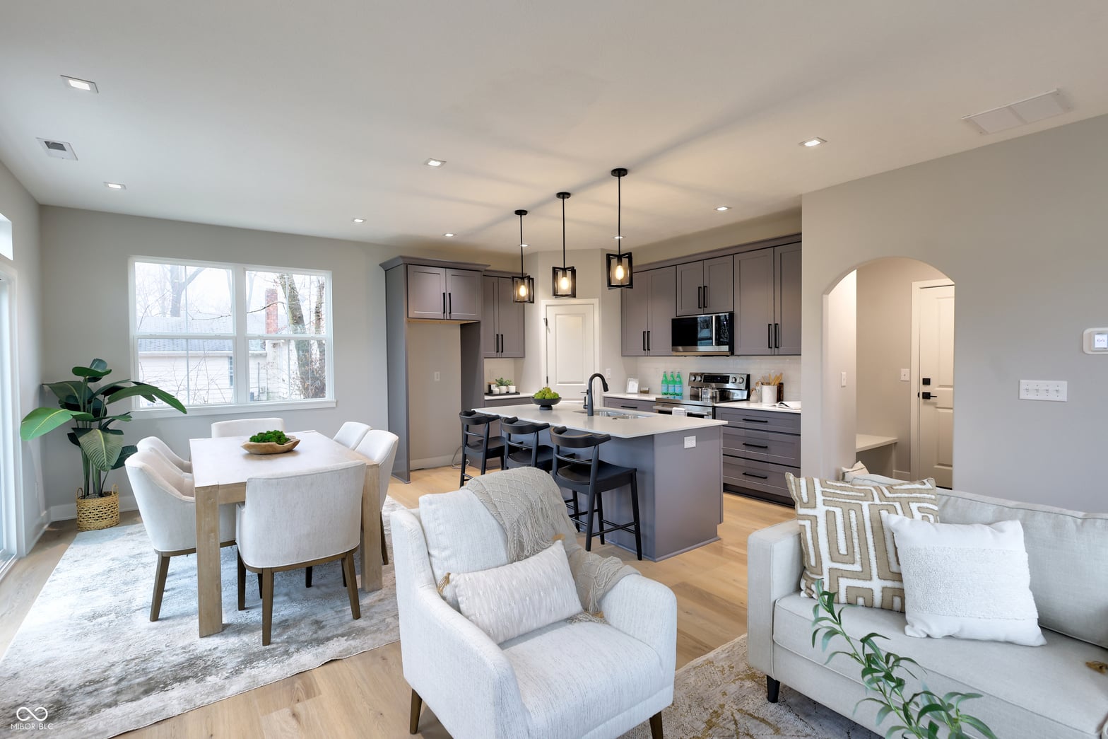 Modern kitchen with island, gray cabinets, and stainless appliances