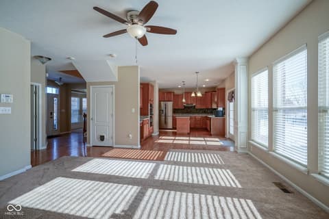 Family room at 14903 Stable Stone Terrace, Fishers, IN — Bright open concept living space with cherry kitchen.