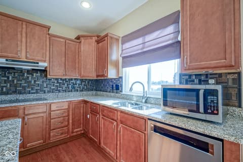 Kitchen at 14903 Stable Stone Terrace, Fishers, IN — Updated kitchen with granite counters and modern appliances.