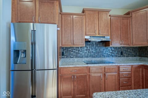 Kitchen at 14903 Stable Stone Terrace, Fishers, IN — Updated kitchen with granite counters and modern appliances.