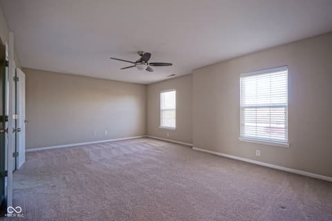 Primary bedroom at 14903 Stable Stone Terrace, Fishers, IN — Spacious primary bedroom with abundant natural light.