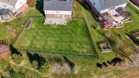 Aerial view at 14903 Stable Stone Terrace, Fishers, IN — Spacious, level yard with mature privacy landscaping.