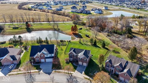 Aerial view at 14903 Stable Stone Terrace, Fishers, IN — Lakefront estate with pond views and acreage