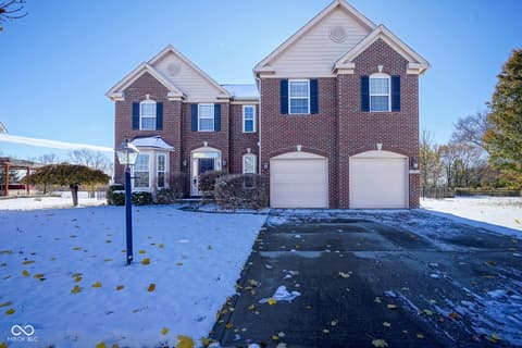 Front exterior at 14903 Stable Stone Terrace, Fishers, IN — Classic brick colonial with two-car garage and curb appeal.
